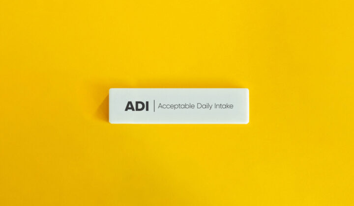 Acceptable Daily Intake, ADI, Banner. Text on Block Letter Tile on Yellow Background. Minimal Aesthetic.