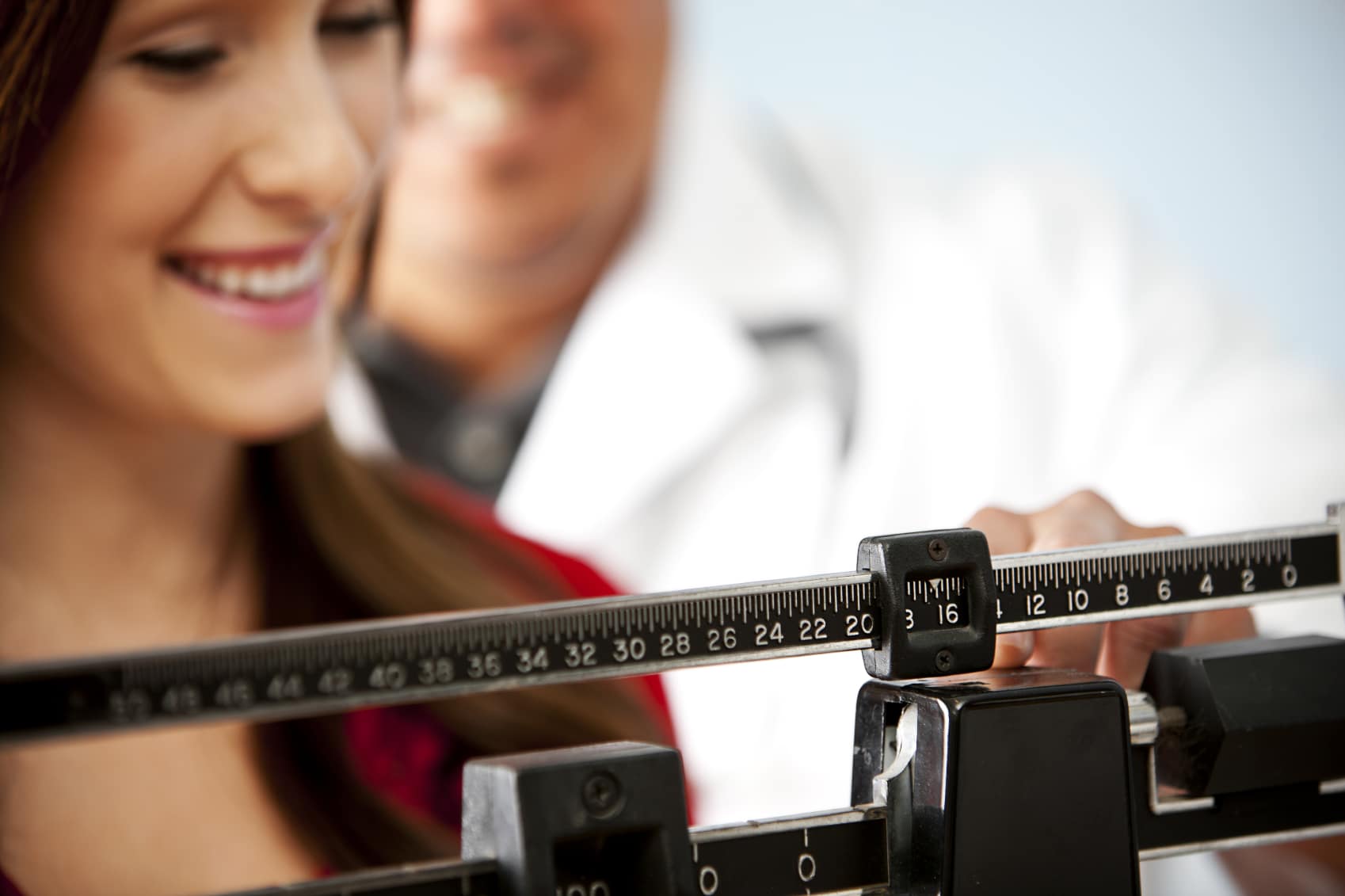 Woman on scale iStock 000015939684Medium