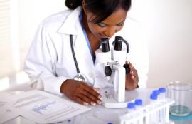 Female lab tech with microscope