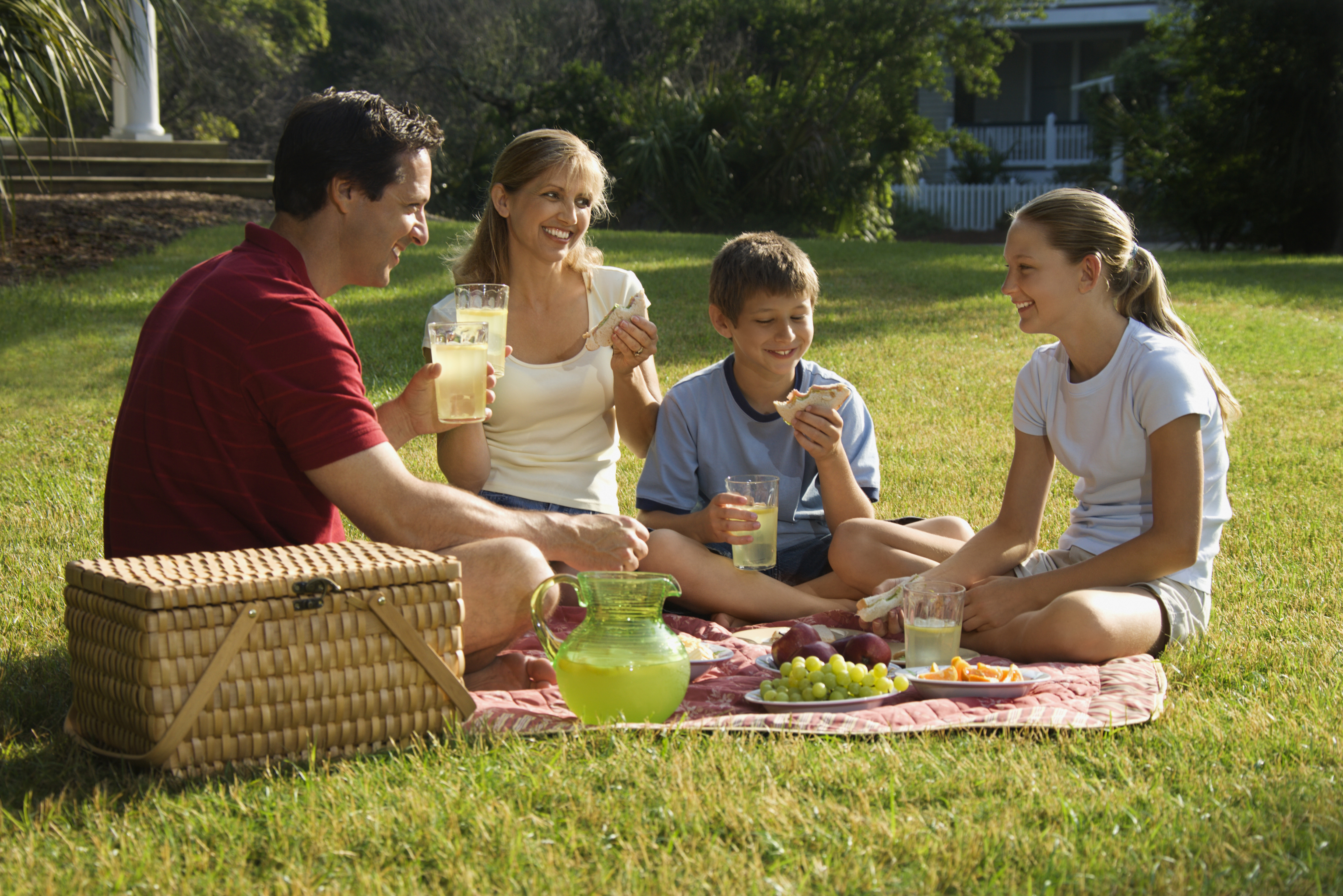 Family having picnic in park. - Calorie Control Council